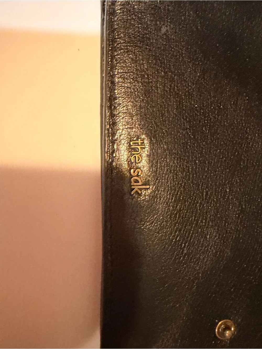 The Sak Black Leather Zip-Around Wallet with Gold Stud Trim
